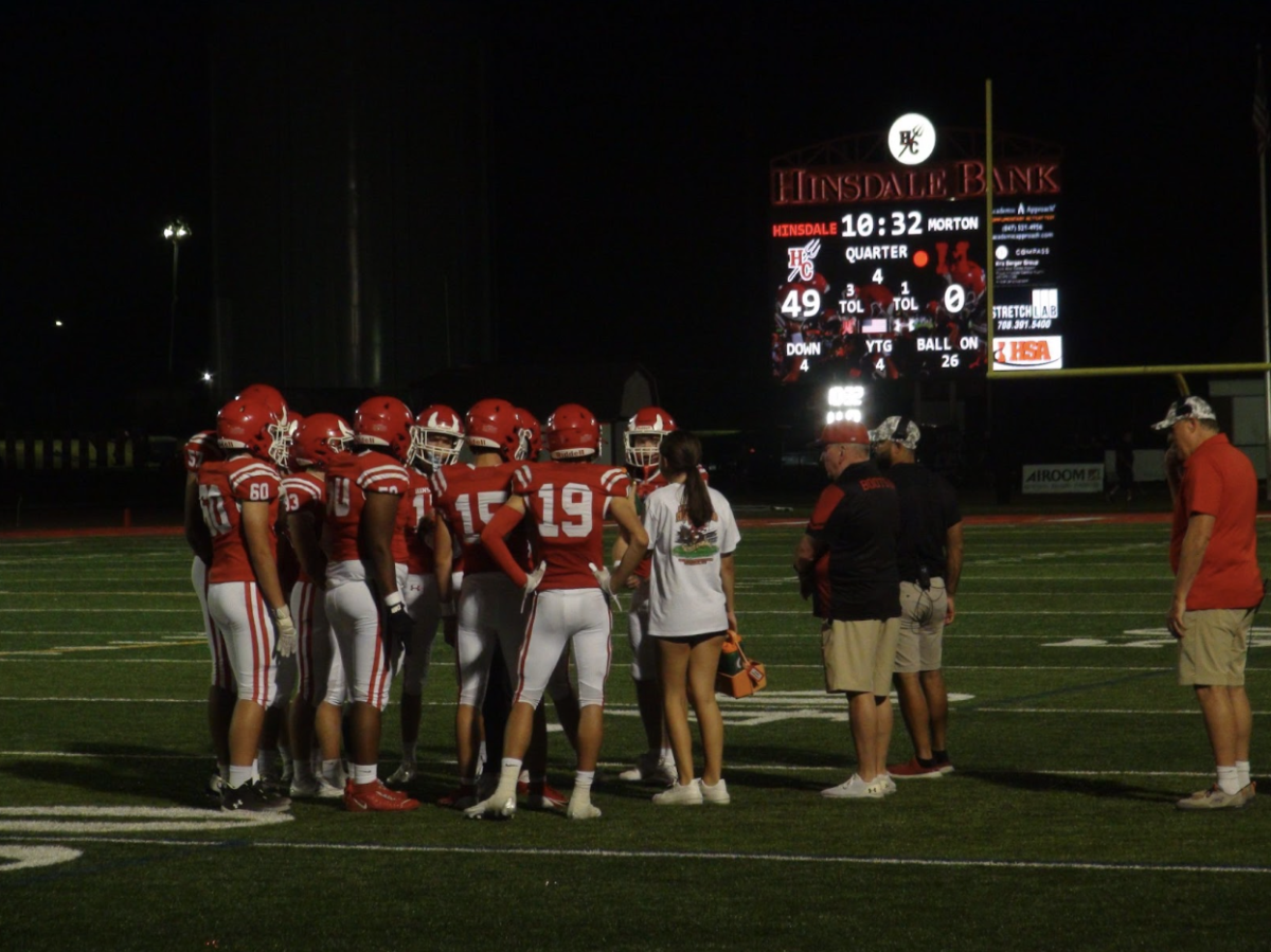 The Red Devils take a breather as Morton discusses a game plan during a Morton timeout.